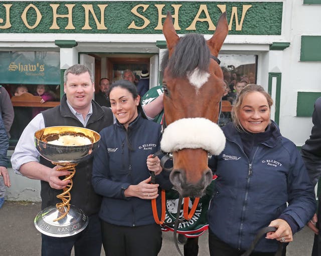 The winning crew posed outside Shaw's Pub in Summerhill (Niall Carson/PA)
