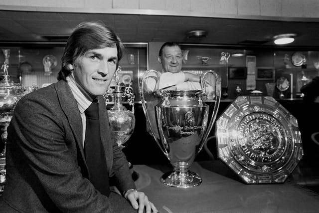Kenny Dalglish admires the silverware in the club's trophy room with manager Bob Paisley