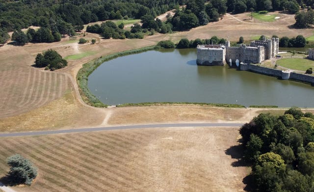 Aerial view of the parched lawns around Leeds Castle in Kent 