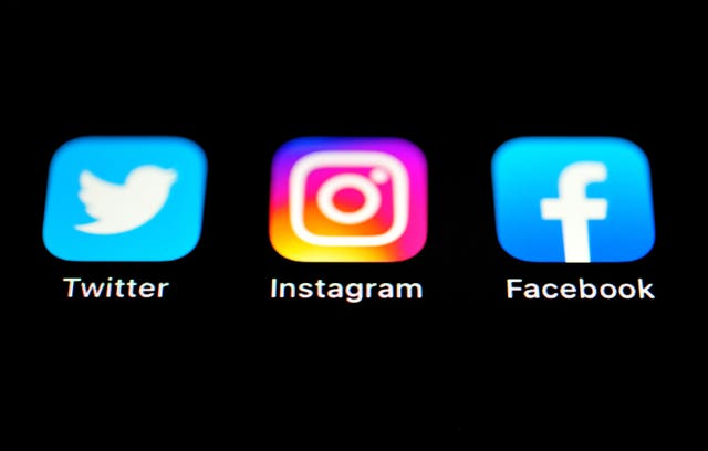 The Twitter, Instagram and Facebook Apps on an Iphone screen (Matthew Vincent/PA)