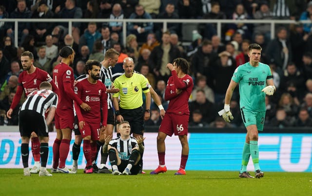 Nick Pope leaves the pitch after being being shown a red card