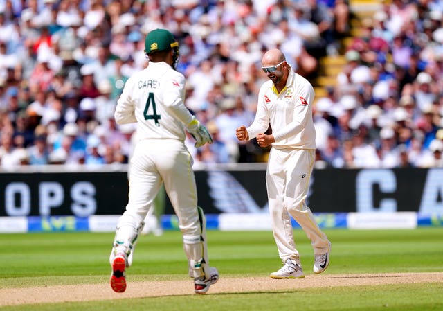 Nathan Lyon, right, celebrates with wicketkeeper Alex Carey after taking the wicket of England’s Jonny Bairstow in the first Ashes Test at Edgbaston