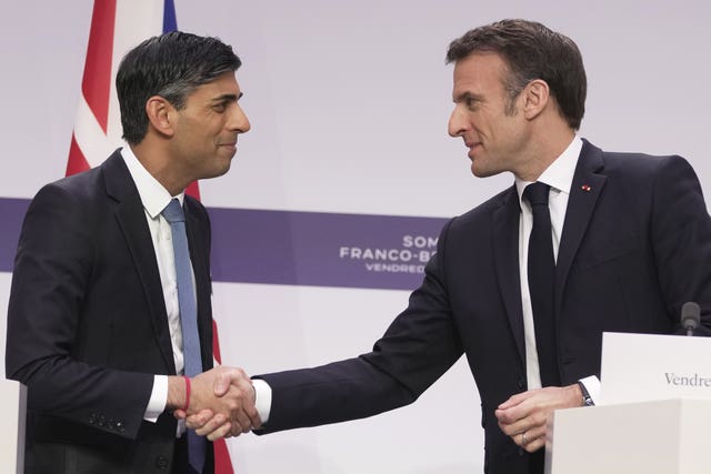 Rishi Sunak shakes hands with Emmanuel Macron