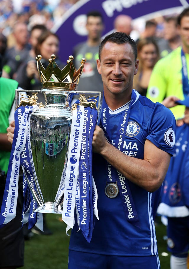 Chelsea's John Terry celebrates with the Premier League trophy
