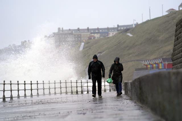 Big waves hit the sea wall at Whitby Yorkshire
