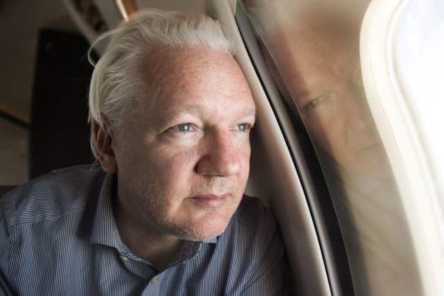 Julian Assange on board a flight to Bangkok, Thailand, following his release from prison 