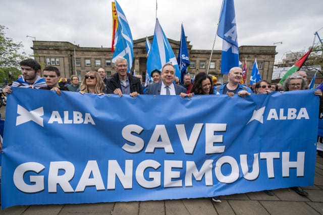 Alba politicians carrying a banner saying 'Save Grangemouth' during a march