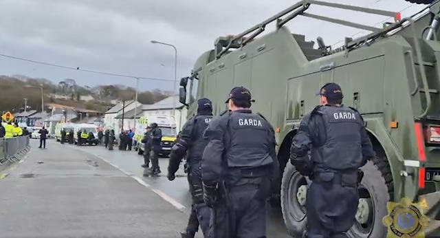 Garda officers on a road