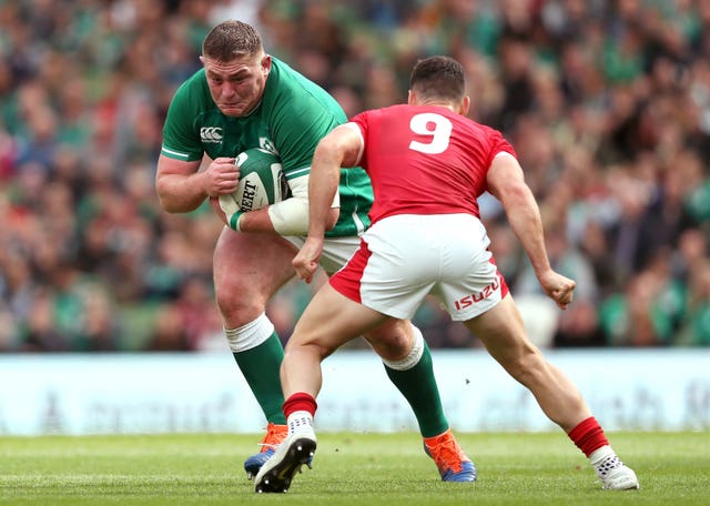Ireland’s Tadhg Furlong (left) and Wales’ Tomos Williams battle for the ball