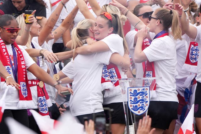 England players embrace on the stage
