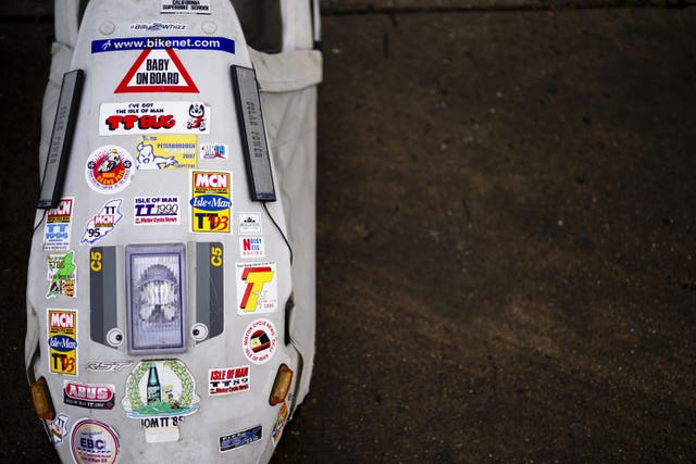 A Sinclair C5 decorated with a myriad of stickers 