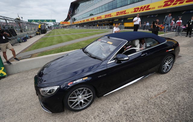 Sir Frank Williams goes out on a 'hot lap' with Mercedes driver Lewis Hamilton