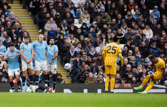 Pervis Estupinan, extreme right, scores Brighton's first goal from a free-kick