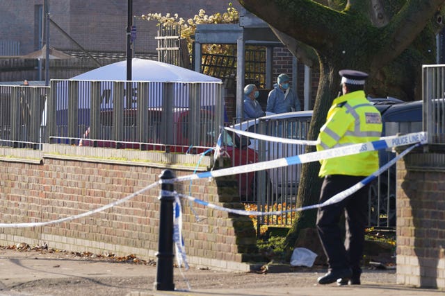 Forensic officers at the scene near Vine Close, Hackney 