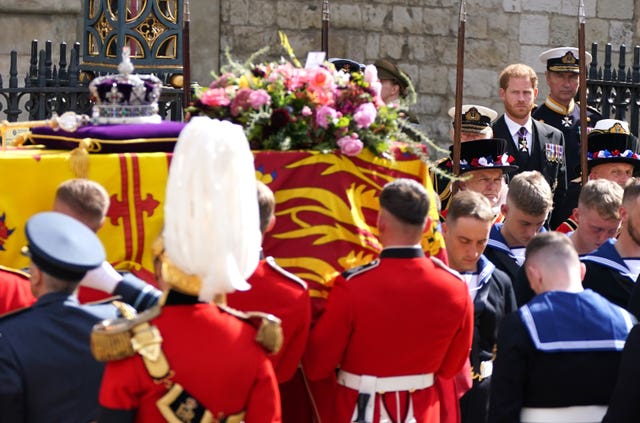The Duke of Sussex looks at the coffin following his grandmother's funeral