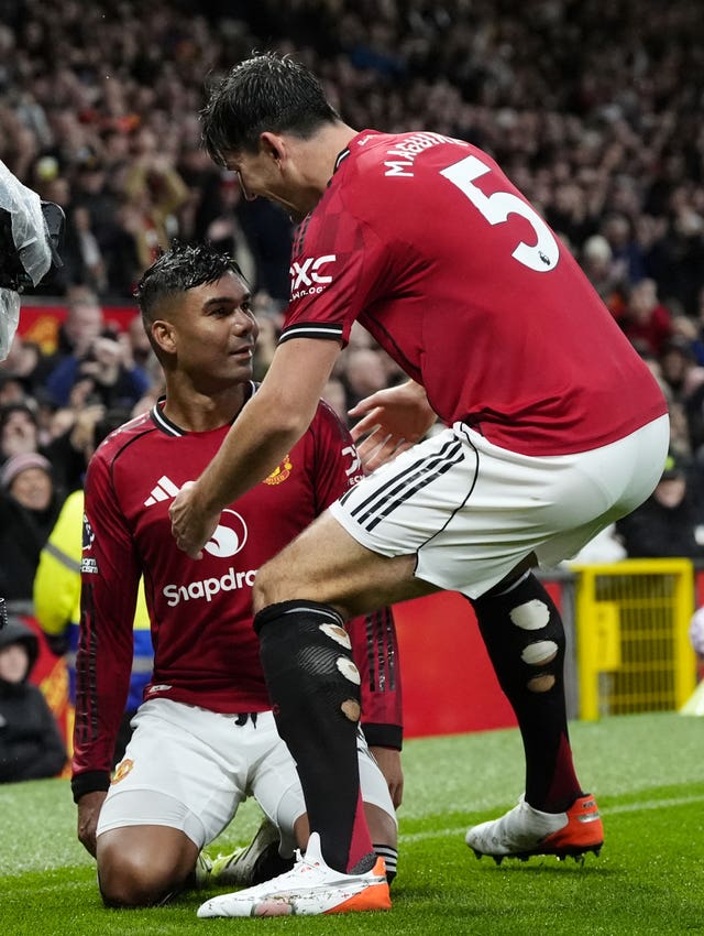Manchester United’s Casemiro celebrates with Harry Maguire 