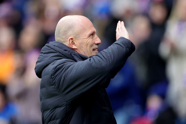 Philippe Clement waves to the Rangers fans. 