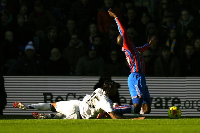 Leny Yoro (left) concedes a penalty against Crystal Palace 