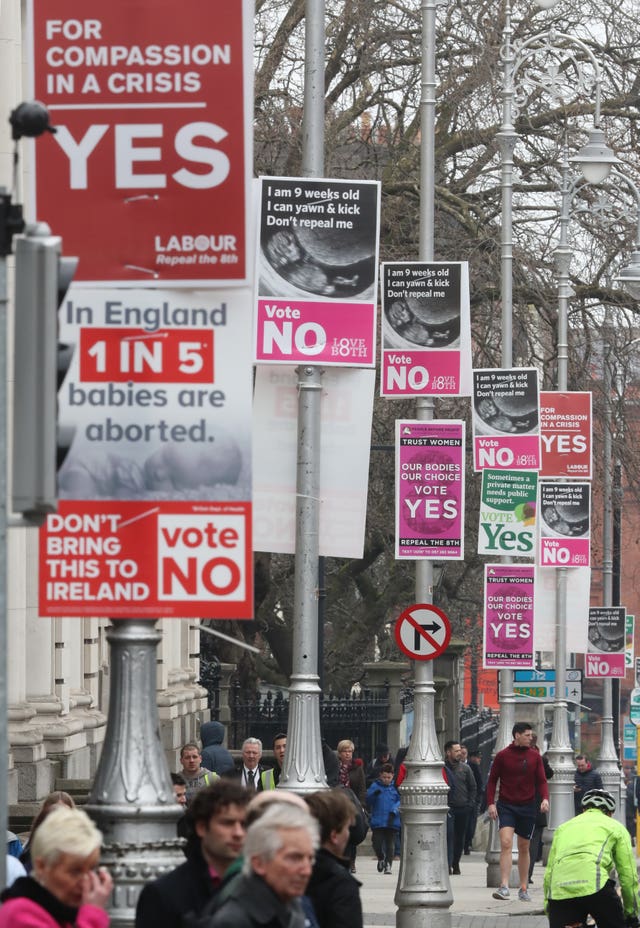 A view of posters in favour of and against abortion (Niall Carson/PA)