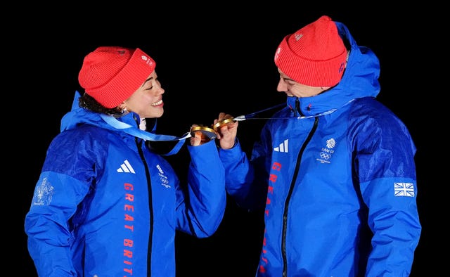 Tabby Stoecker and Matt Weston celebrate on the podium