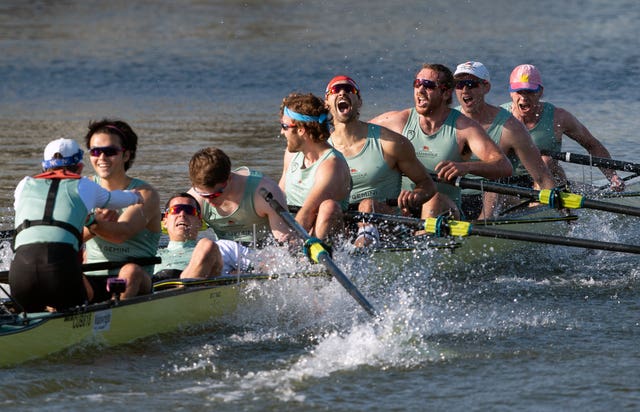Cambridge celebrate winning the 166th Men’s Boat Race on the River Great Ouse near Ely in Cambridgeshire 