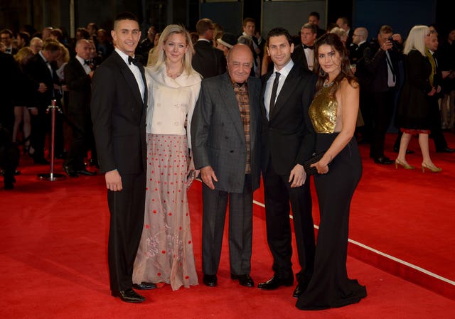 Mohamed Al-Fayed and family attending a film premiere of Spectre 