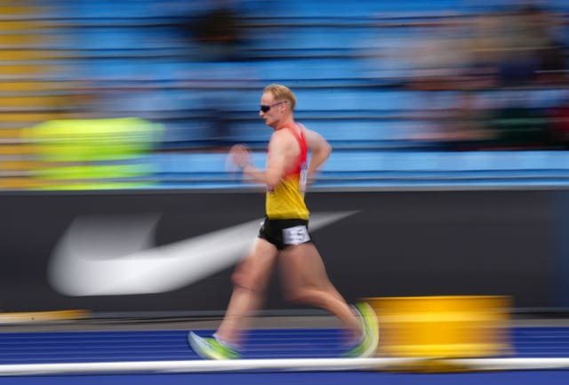Motion blur surrounds Callum Wilkinson as he competes in the men's 10,000m walk at the UK Athletics Championships and Olympic trials in Manchester