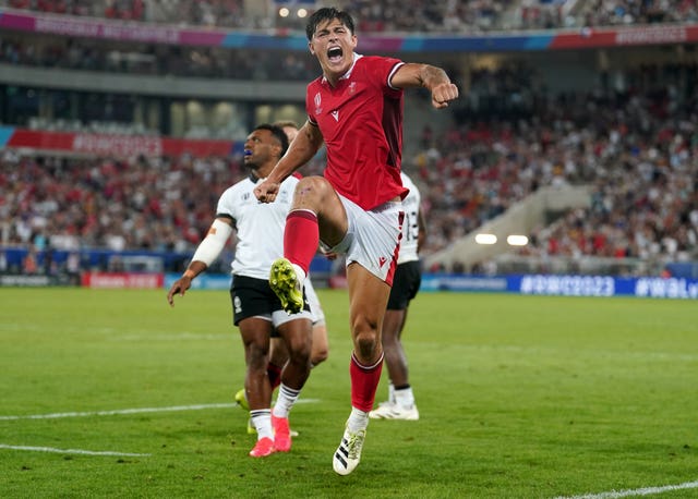 Louis Rees-Zammit celebrates at the final whistle of Wales' victory over Fiji (David Davies/PA)