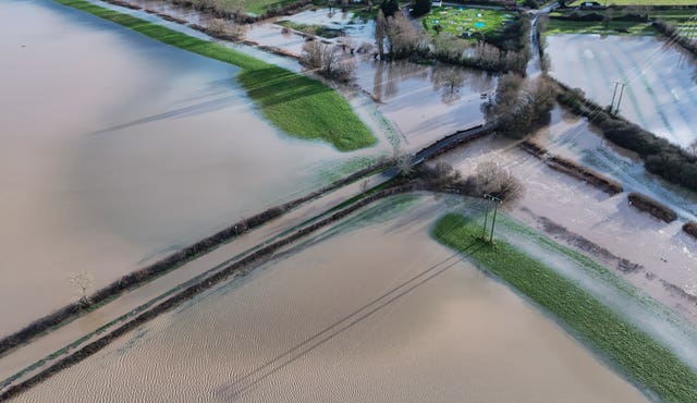 Eckington Bridge in Worcestershire is surrounded by flood water after the River Avon burst its banks, following snow and rain over the weekend