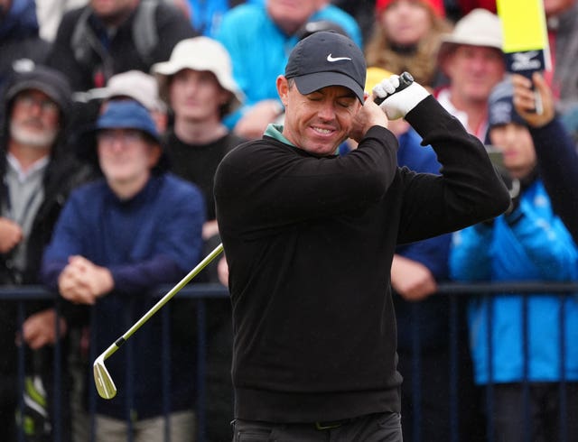 Rory McIlroy grimaces after playing a shot