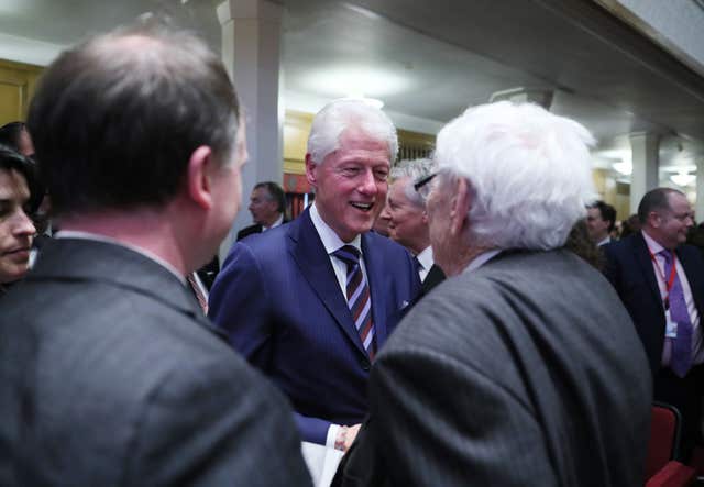 Former US President Bill Clinton greets Seamus Mallon (Brian Lawless/PA