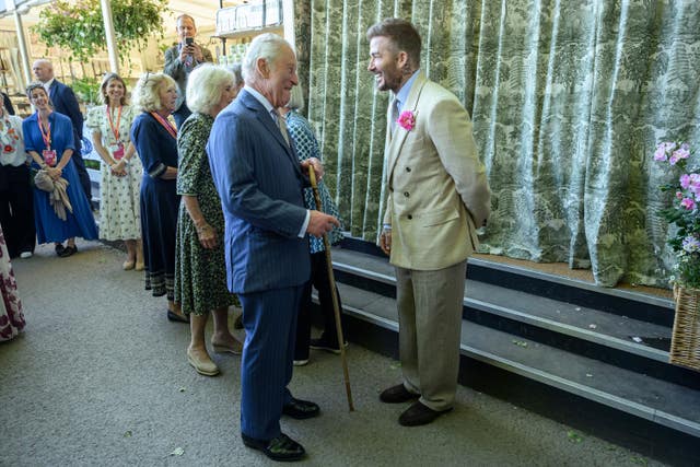 The King meeting David Beckham during a visit to the RHS Chelsea Flower Show