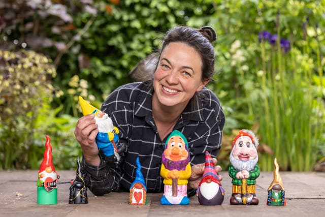 A woman and a selection of gnomes 