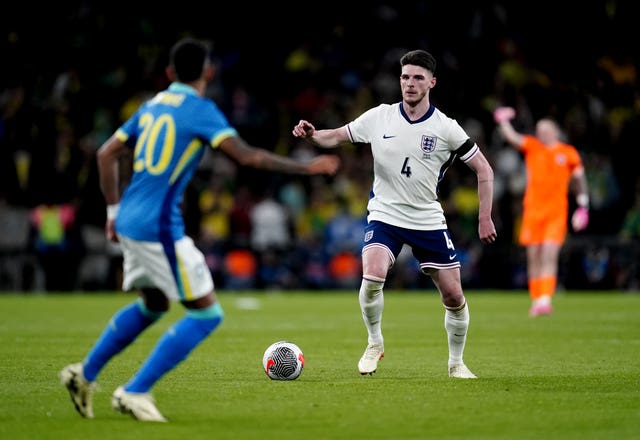 Declan Rice (right) controls the ball - England v Brazil