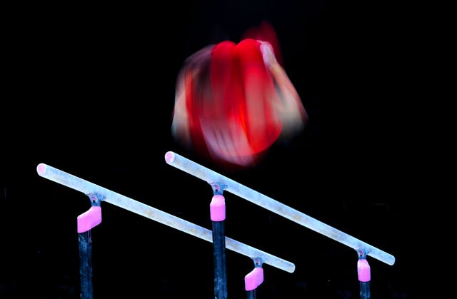 An athlete on the parallel bars