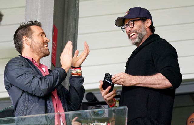 Wrexham co-owner Ryan Reynolds (left) and Hugh Jackman in the stands before the Sky Bet League Two match against MK Dons