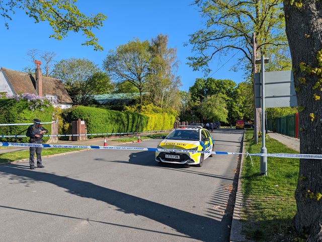 Police officers patrol at a cordon near to an incident at the Kenton United Synagogue in Harrow, north-west London