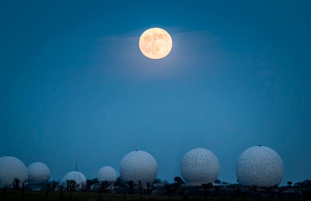 The wolf moon rises above Menwith Hill near Harrogate, North Yorkshir