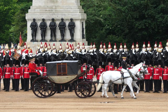 A mock-up of the royal carriage arriving at Horse Guards Parade at exactly 11am