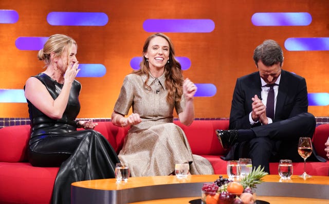 Kate Winslet, left, laughing on the sofa on The Graham Norton Show alongside fellow guests Jacinda Ardern, centre, and Seth Meyers