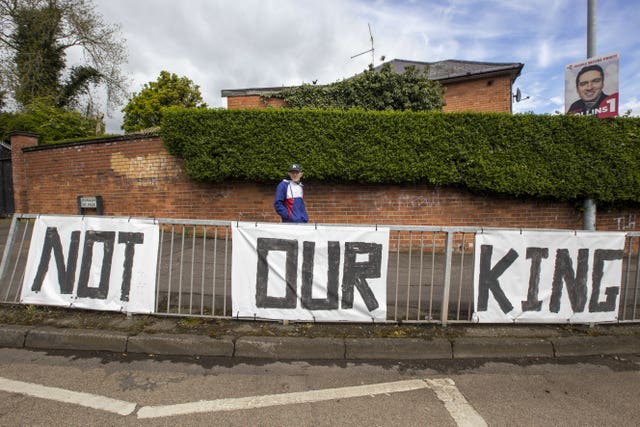 Anti-monarchy signs on the railings of the Monagh bypass roundabout in Andersonstown, west Belfast 