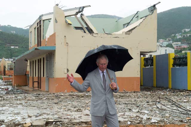Hurricanes are an annual threat in the Caribbean and the Prince of Wales surveys the British Virgin Islands in November 2017 following a major storm. Arthur Edwards/The Sun