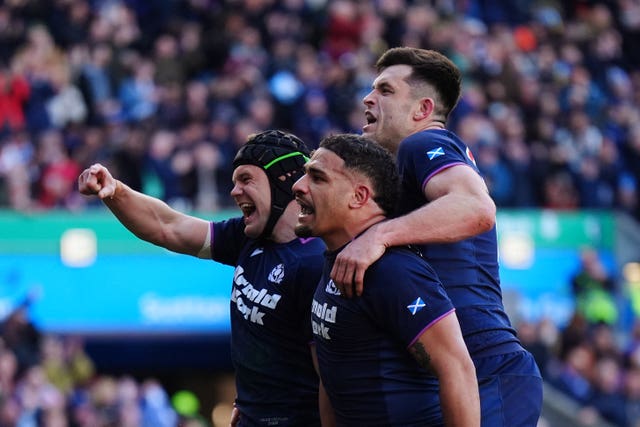 Scotland’s Darcy Graham (left) celebrates scoring a try 