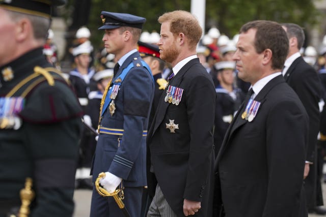 The Prince of Wales, the Duke of Sussex and Peter Phillips following Queen Elizabeth II's coffin on the day of her funeral