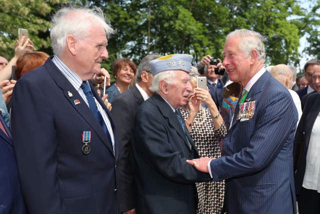 Charles met veterans who took part in the ceremony (Andrew Matthews/PA) 