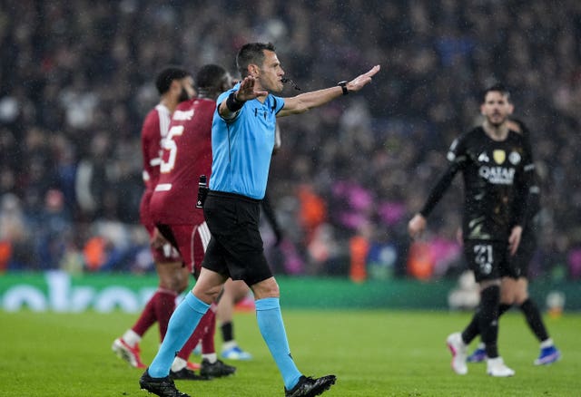 Referee Maurizio Mariani overturns a penalty decision for Liverpool