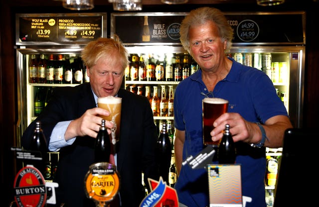 Boris Johnson and Tim Martin in happier times (Henry Nicholls/PA)