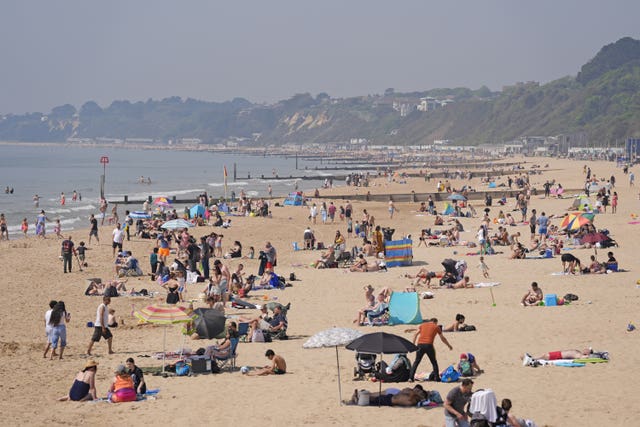 People enjoying the sunny weather on Bournemouth Beach