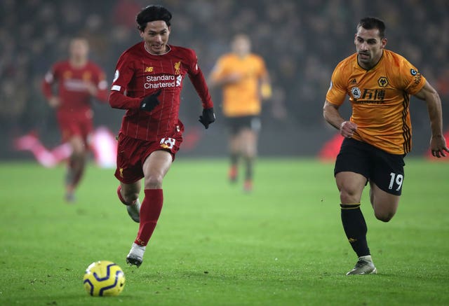 Takumi Minamino, left, came on against Wolves