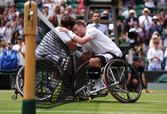 Alfie Hewett (right) is congratulated by Martin De La Puente at the net